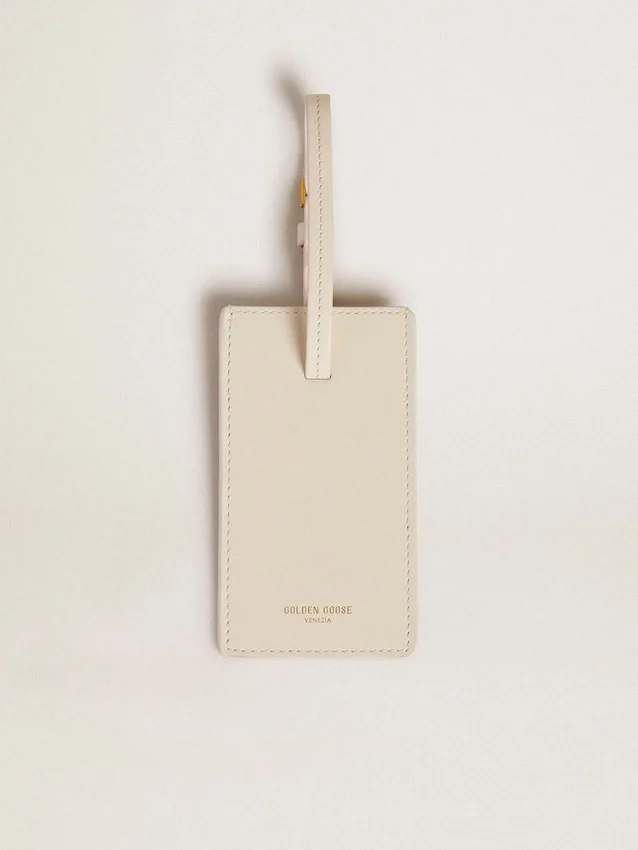 Étiquette de bagage blanche usée