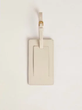 Étiquette de bagage blanche usée