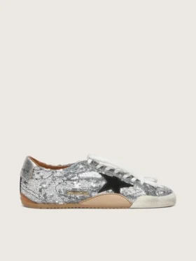 Modèle True-Star pour femme, en paillettes argentées avec une étoile noire et une languette de talon en cuir argenté
