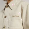 Veste beige pour enfant avec touches multicolores