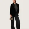 Veste femme à double boutonnage en velours noir avec revers en satin noir