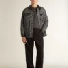 Veste grise à chevrons avec détails en cuir noir
