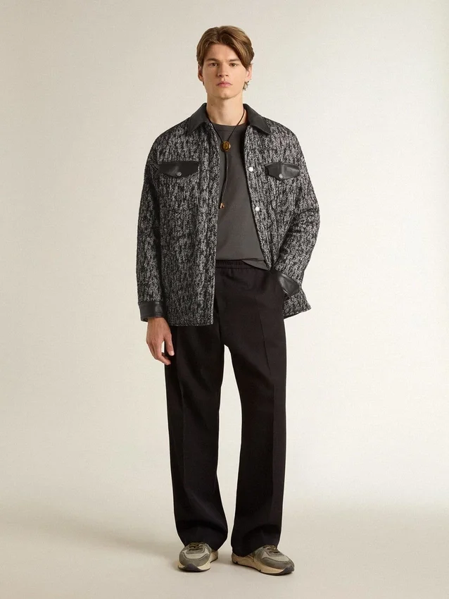 Veste grise à chevrons avec détails en cuir noir