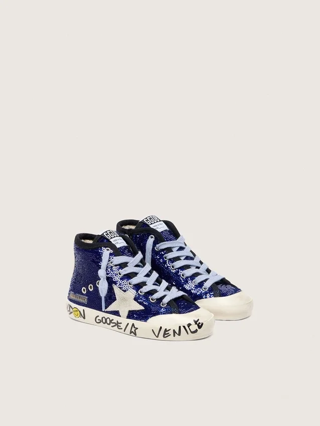 Francy Penstar junior en paillettes bleues avec une étoile en daim blanc